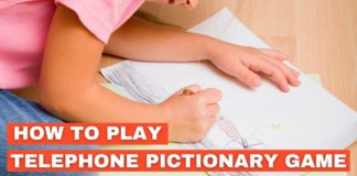 A child drawing on a sheet of paper for a telephone pictionary game