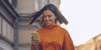 Woman Playing Game on Phone