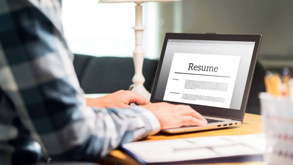 A person writing his resume