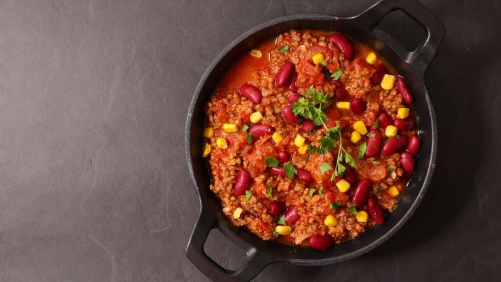 A plate of Chili Con Carne on a table.