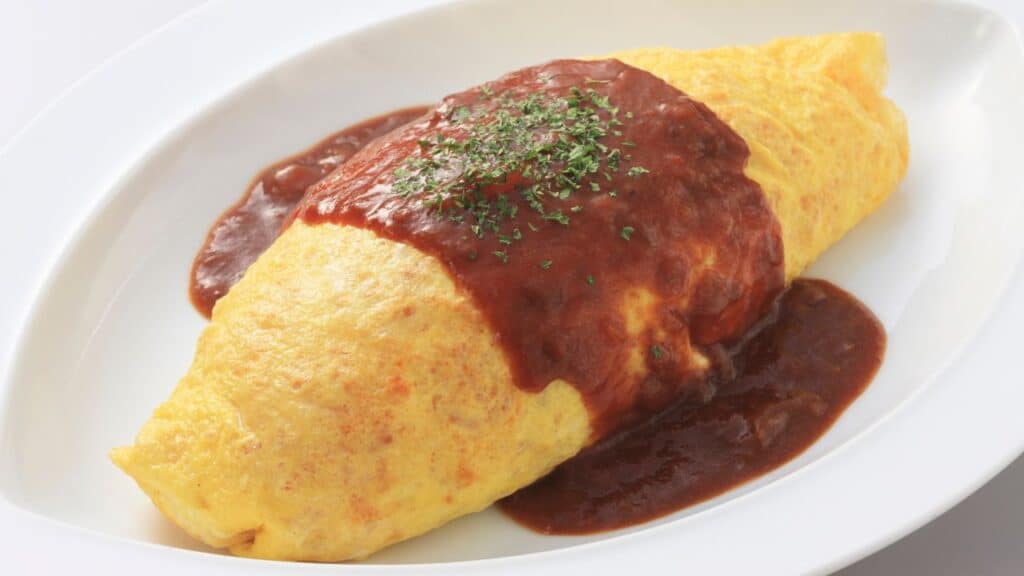 A picture of omurice, a food that starts with the letter O