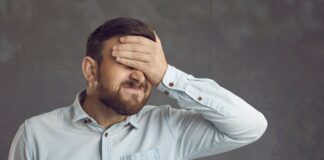 Businessman Covers Face With Hand. Guy Facepalms Feeling Ashamed Of