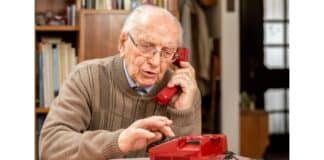 Old Man Listening To Phone