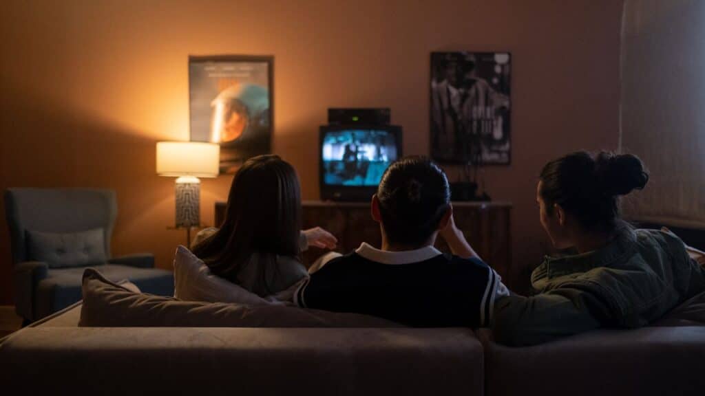 Friends watching a TV