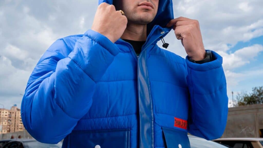 A man wearing a puffer jacket. 