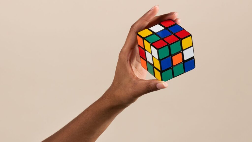 Photo of a person holding a Rubik's Cube