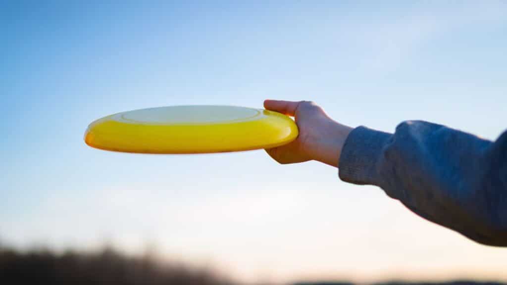 Photo of a person holding a Frisbee