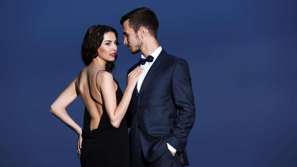 A couple wearing a black tie dress code 