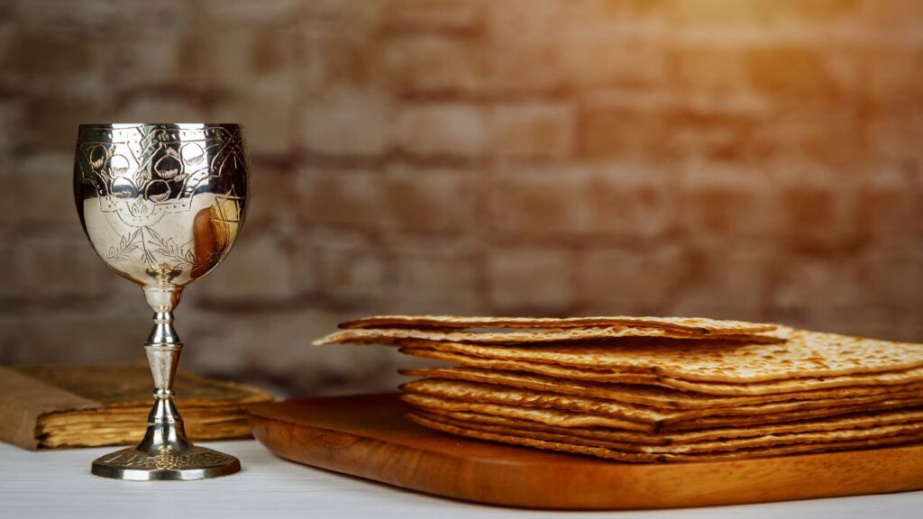 Photo of an Elijah's Cup next to matzah