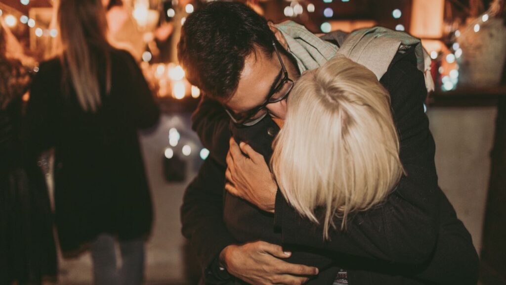 A couple sharing a kiss.