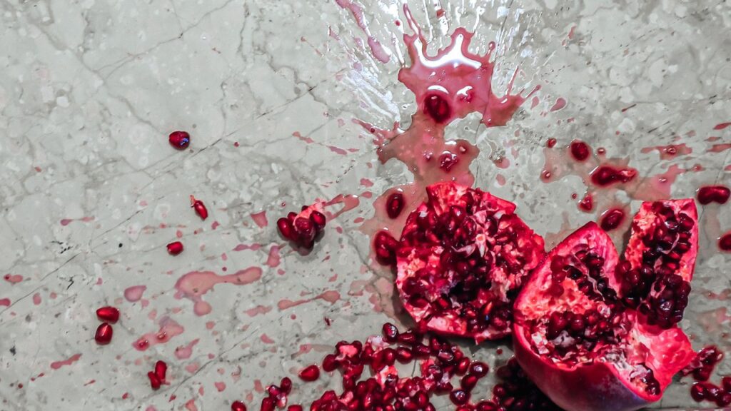 Photo of a smashed pomegranate on the floor