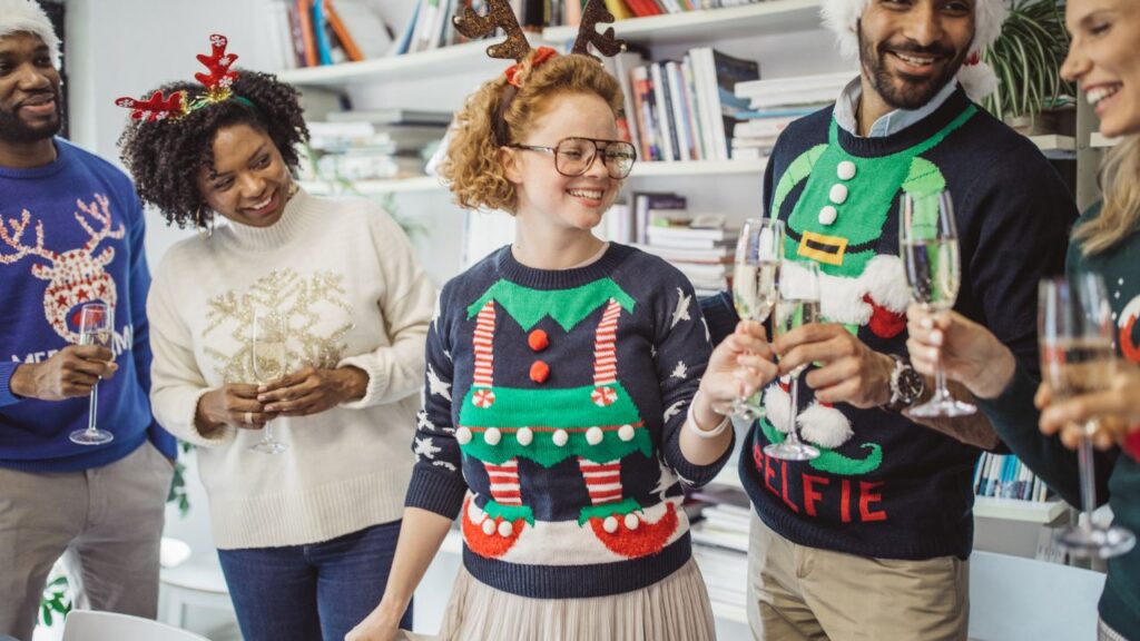 A family wearing ugly Christmas sweaters