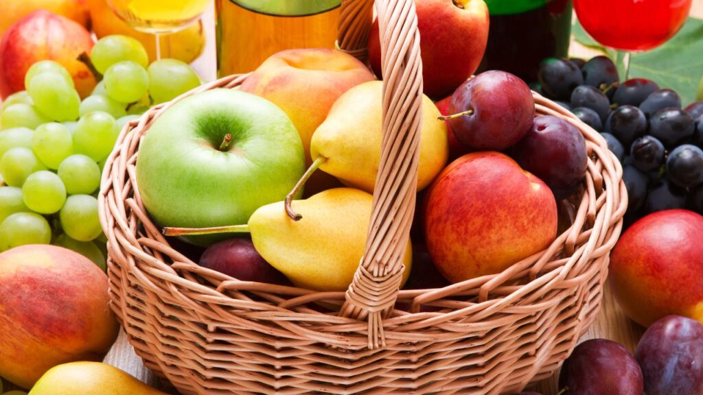 A photo showing a basket of round fruits